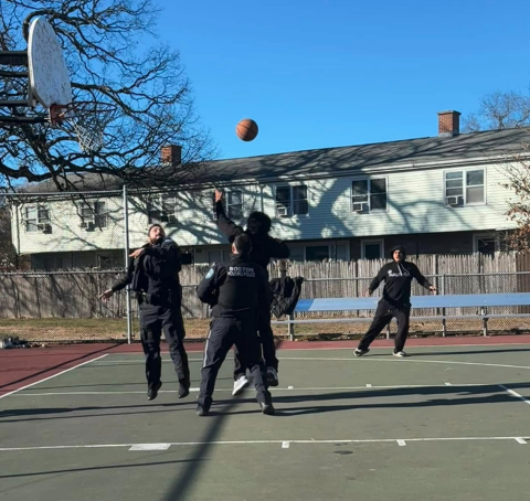 BHA PD officers playing basketball with community